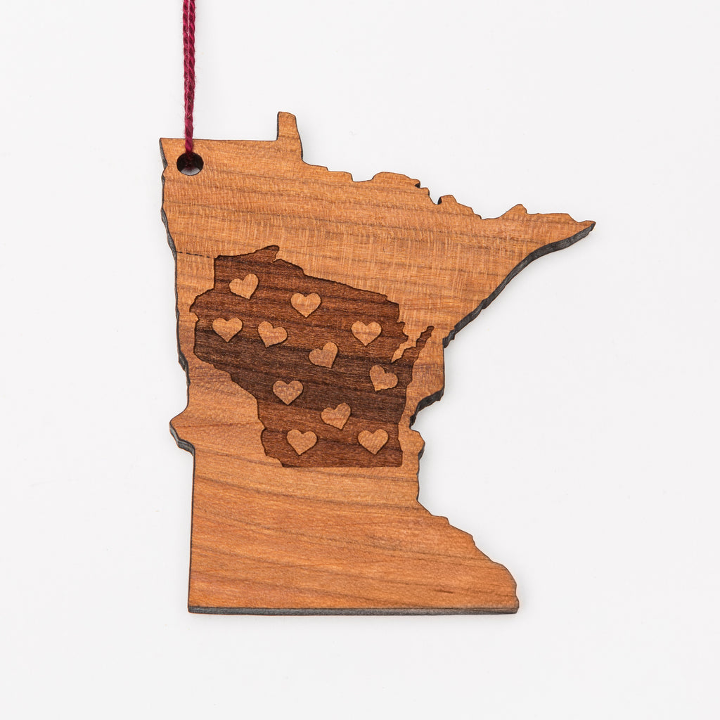 Wisconsin laser etched into a Minnesota-shaped wood ornament