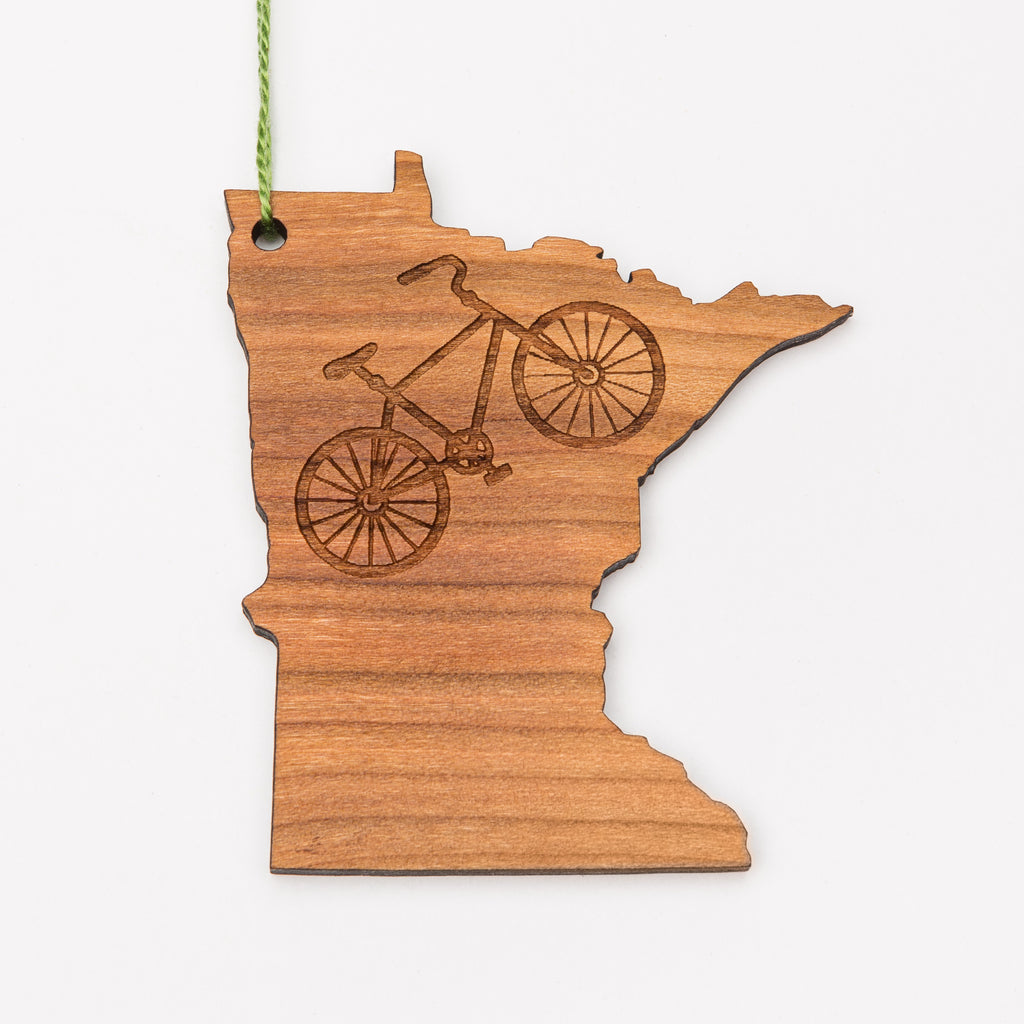 Laser engraved bicycle on a magnet or ornament shaped like Minnesota