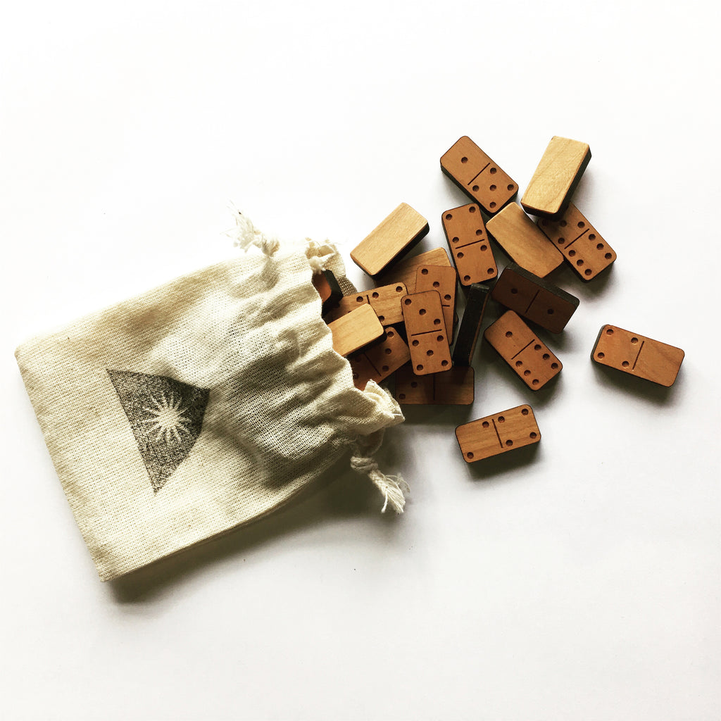 Mini wood block dominoes in a cloth pouch