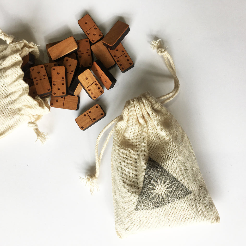 Mini wood block dominoes in cloth bags